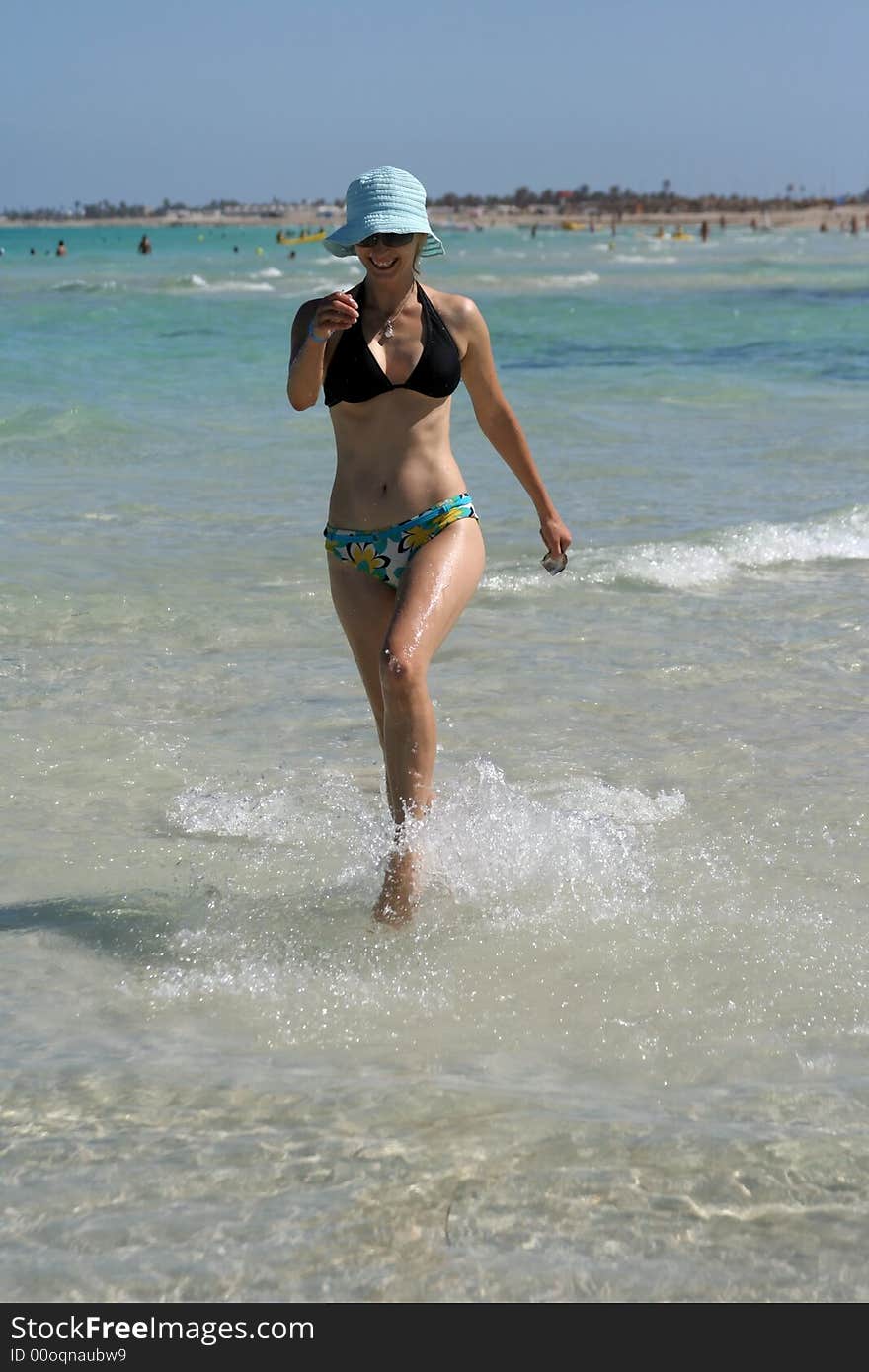 Beautiful woman on the beach.