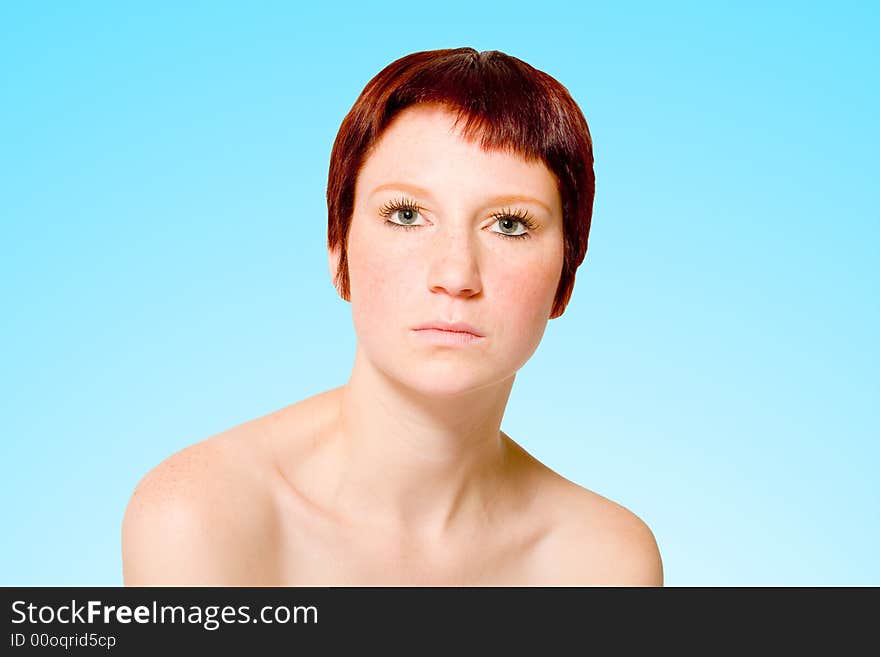 Studio portrait of a young woman with short hair looking neutral. Studio portrait of a young woman with short hair looking neutral