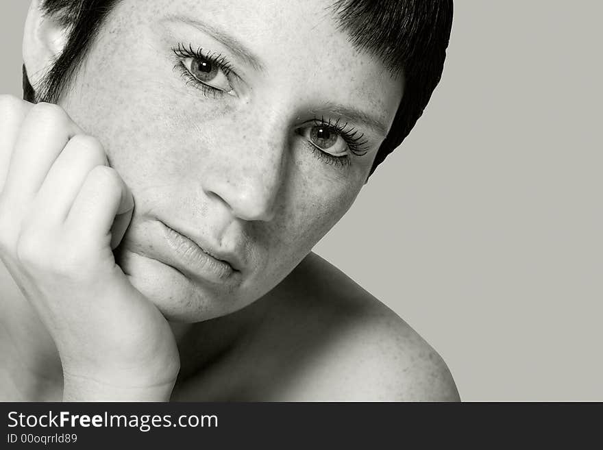 Studio portrait of a bored young woman with short