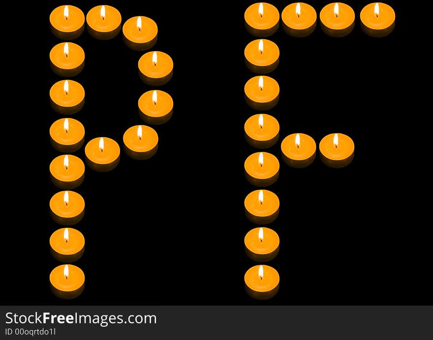 A group of burning candles forming PF on the black background. A group of burning candles forming PF on the black background