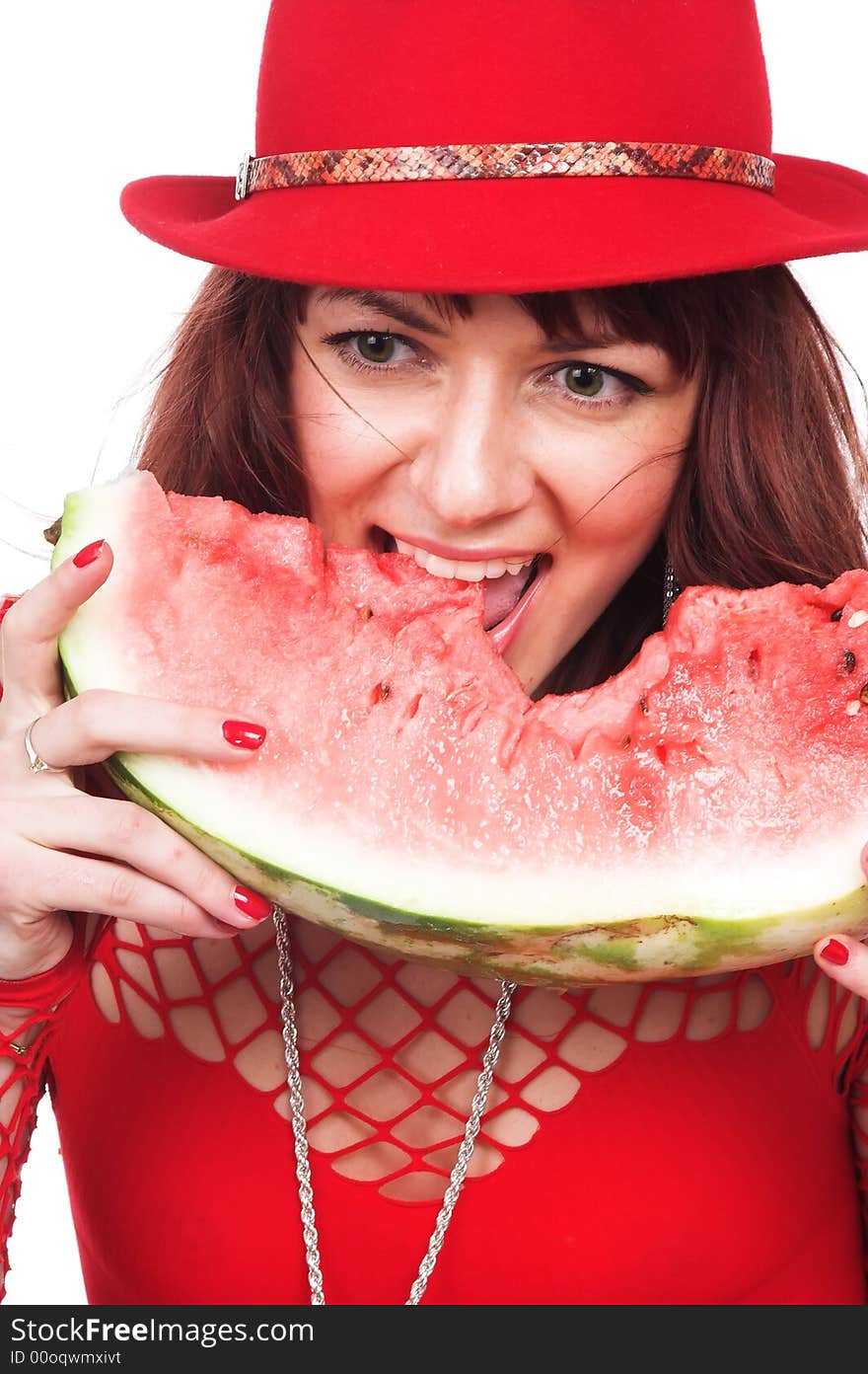 The beautiful girl eats a water-melon