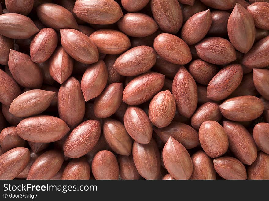 Textured background of pecans in shells