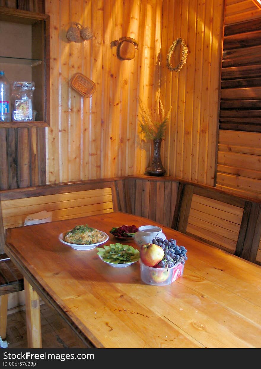 Plates with fruits on yellow table. Plates with fruits on yellow table