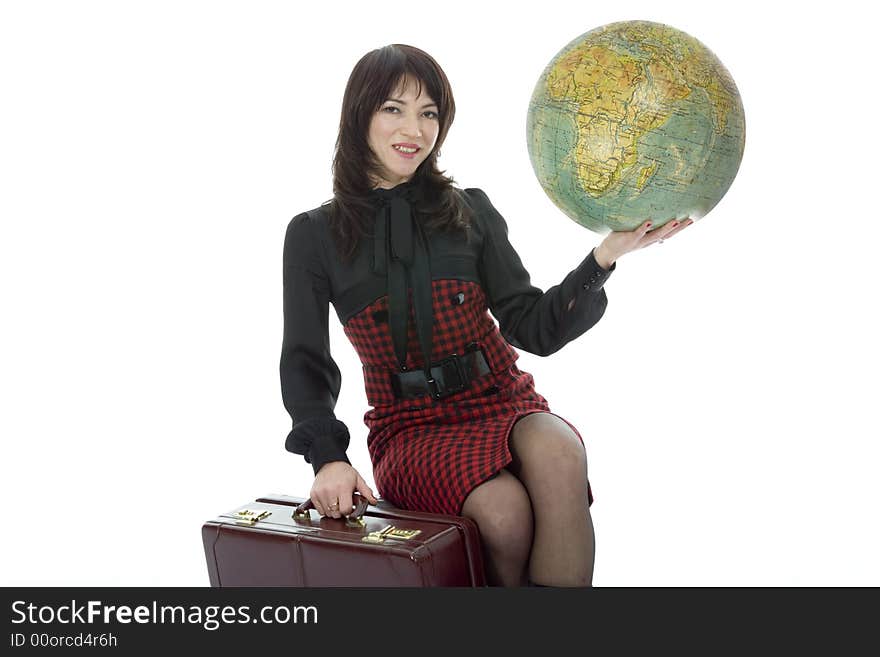 Beautiful brunette with valise and globe on isolated background