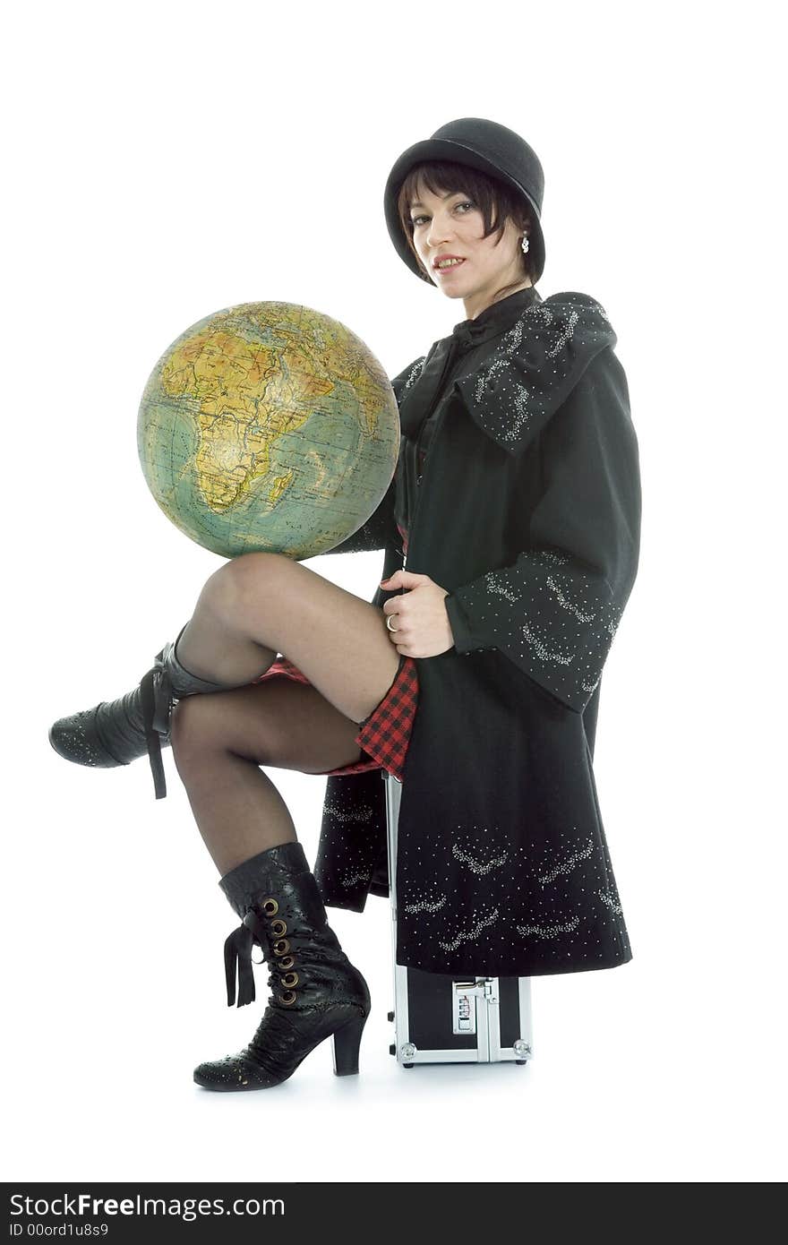 Beautiful brunette with valise and globe on isolated background