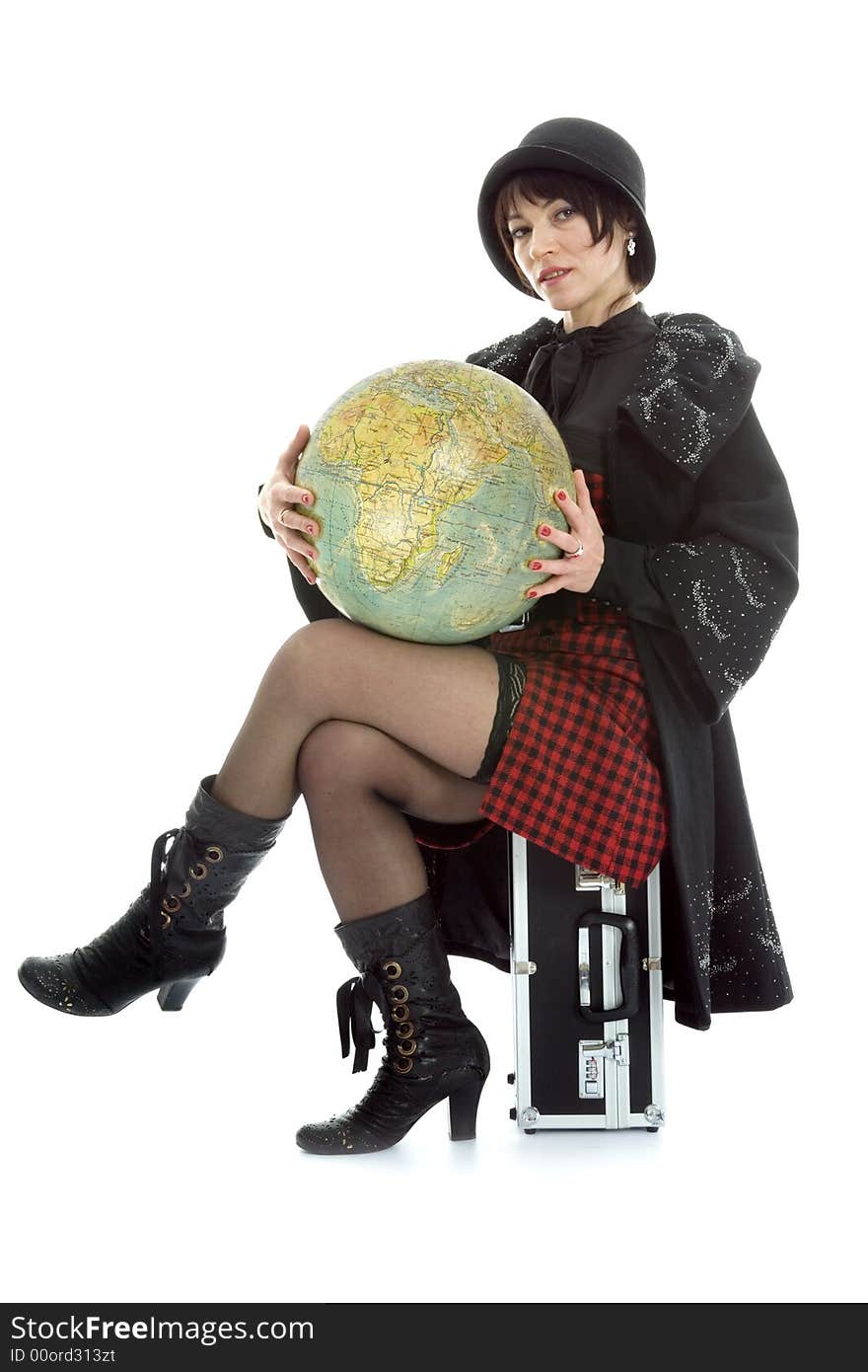 Beautiful brunette with valise and globe