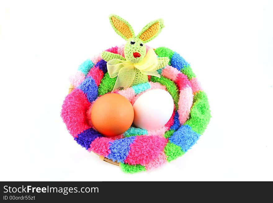 Easter bunny and two eggs in a clutch