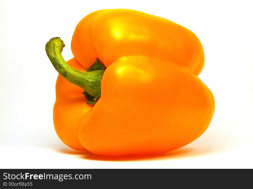 Fruit of yellow paprika against a white background