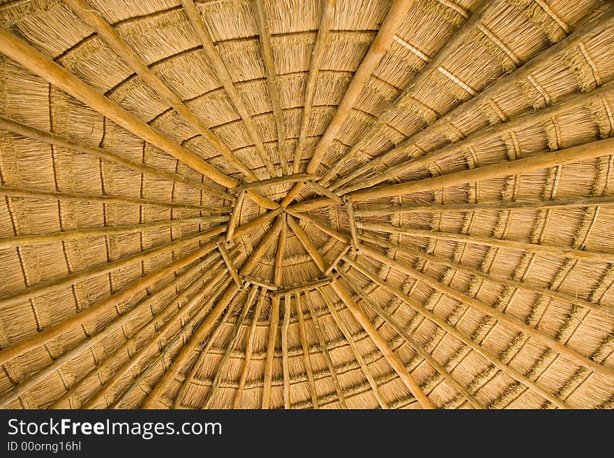 A straw roof on a structure showing concentric circles