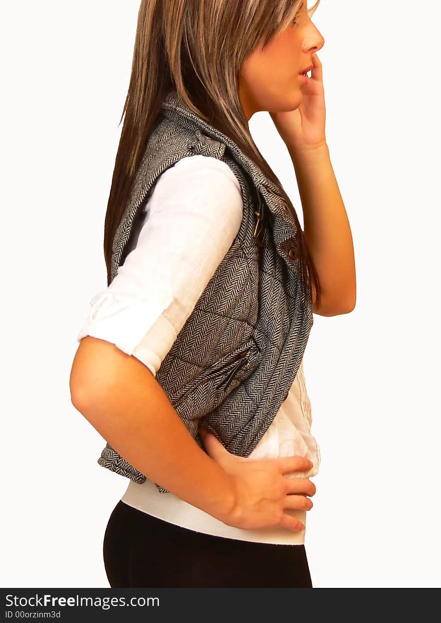 An young lady for white background talking on the cell phone. An young lady for white background talking on the cell phone.