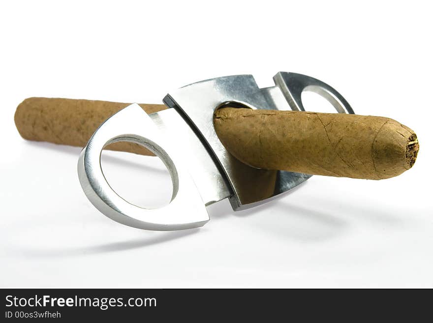 Cigars and accessories on white background