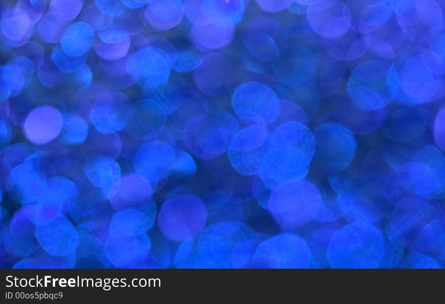 Bright blue glowing defocused light pattern. Bright blue glowing defocused light pattern