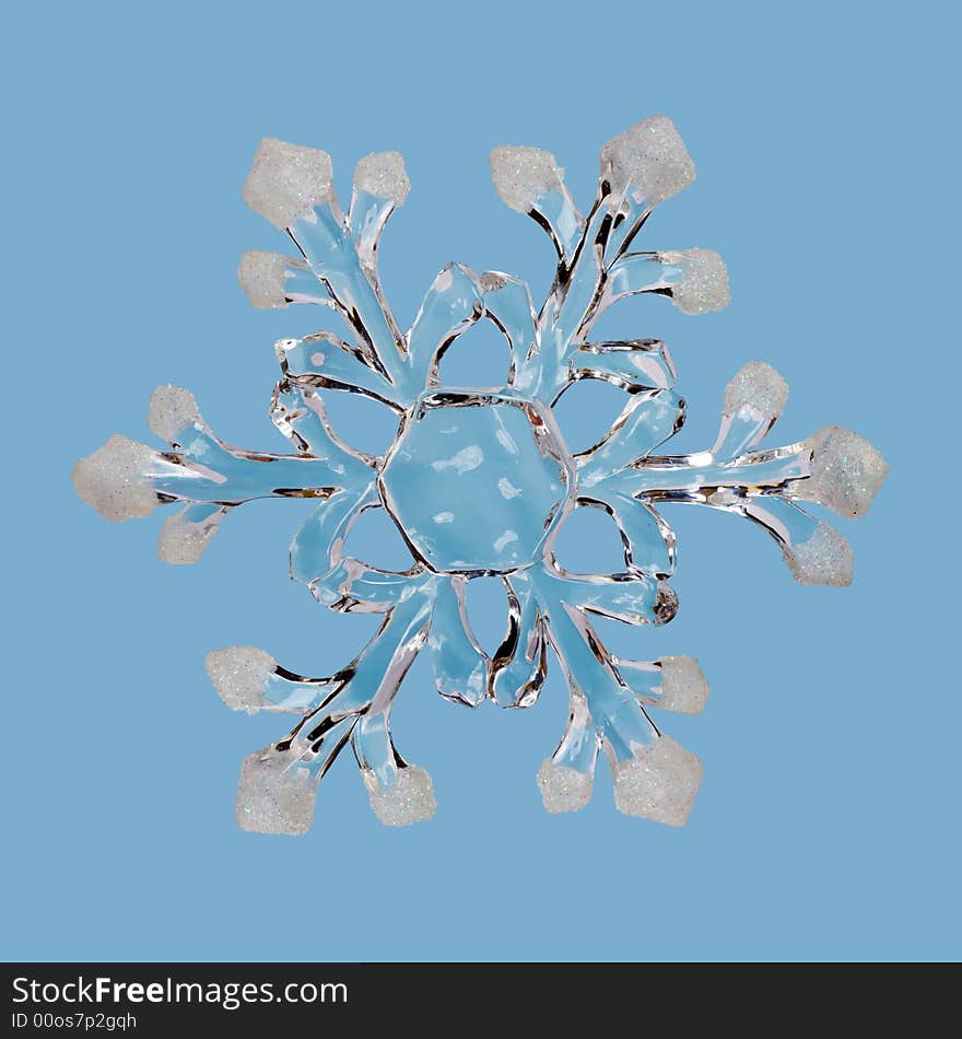 Ice snowflake, isolated on blue background