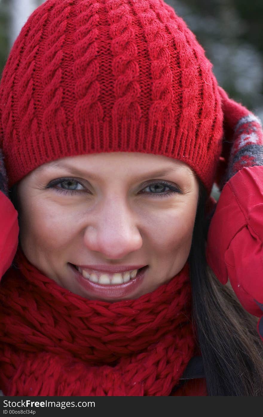 Young beautiful woman in a red cap