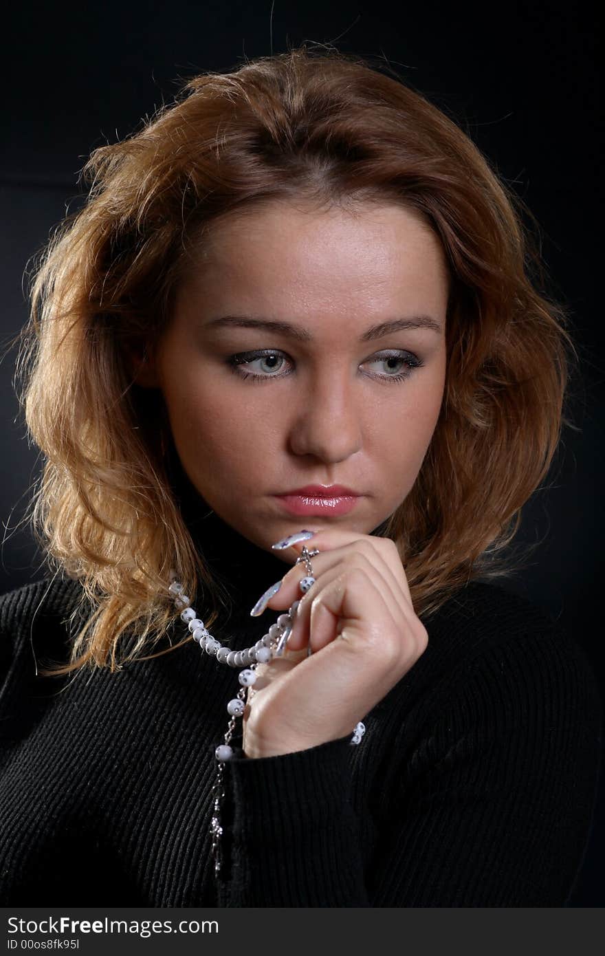 Cute redhead girl portrait on dark background