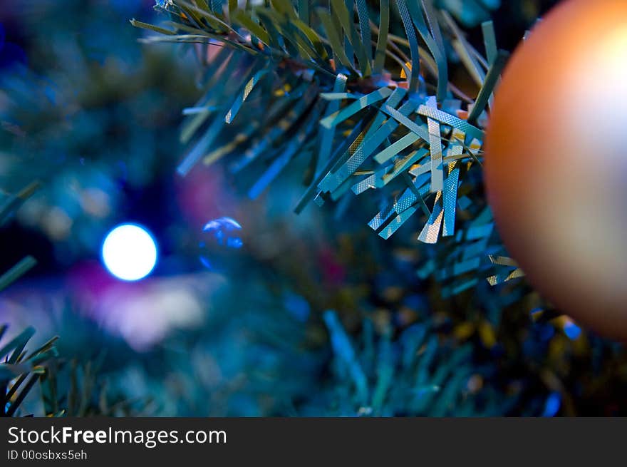 Close-up of Christmas Tree with red and gold ornaments and lights