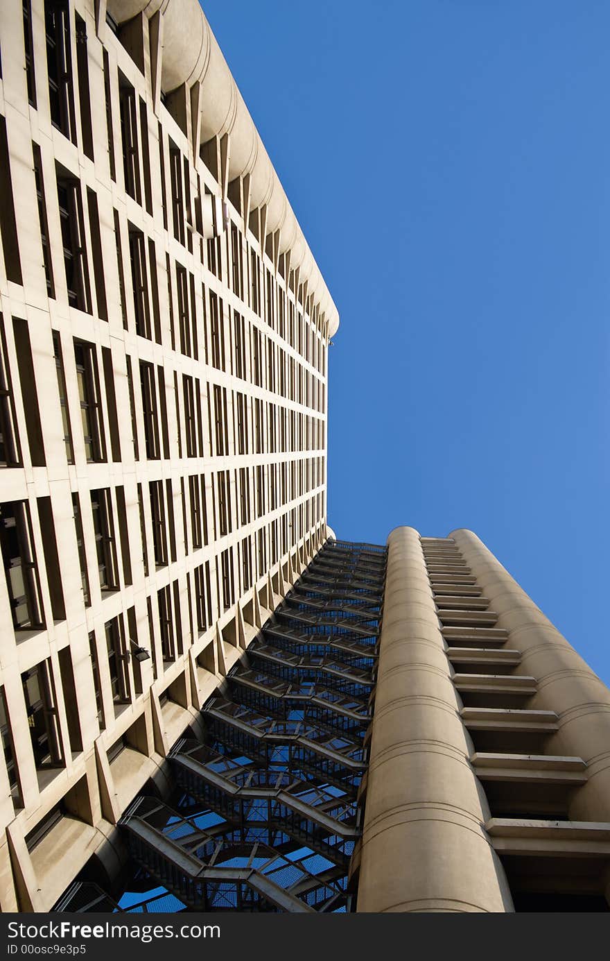 Business Building photographed uward from the bottom. Strong perspective and a lot of space for text.