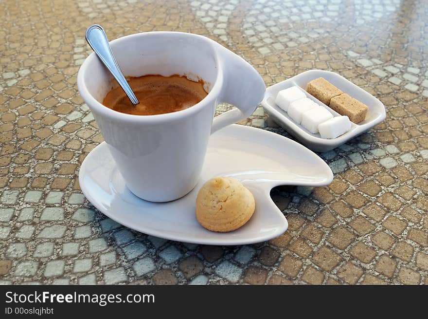 Hot espresso, cookie and yellow and white sugar. Hot espresso, cookie and yellow and white sugar.