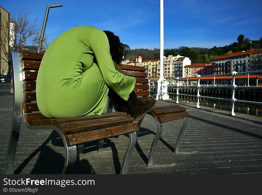 An image of a girl sitting by the river. An image of a girl sitting by the river.