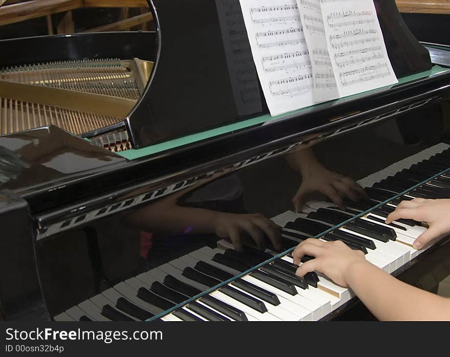 Fragment of hands of the musician playing the pianoclassics. Fragment of hands of the musician playing the pianoclassics