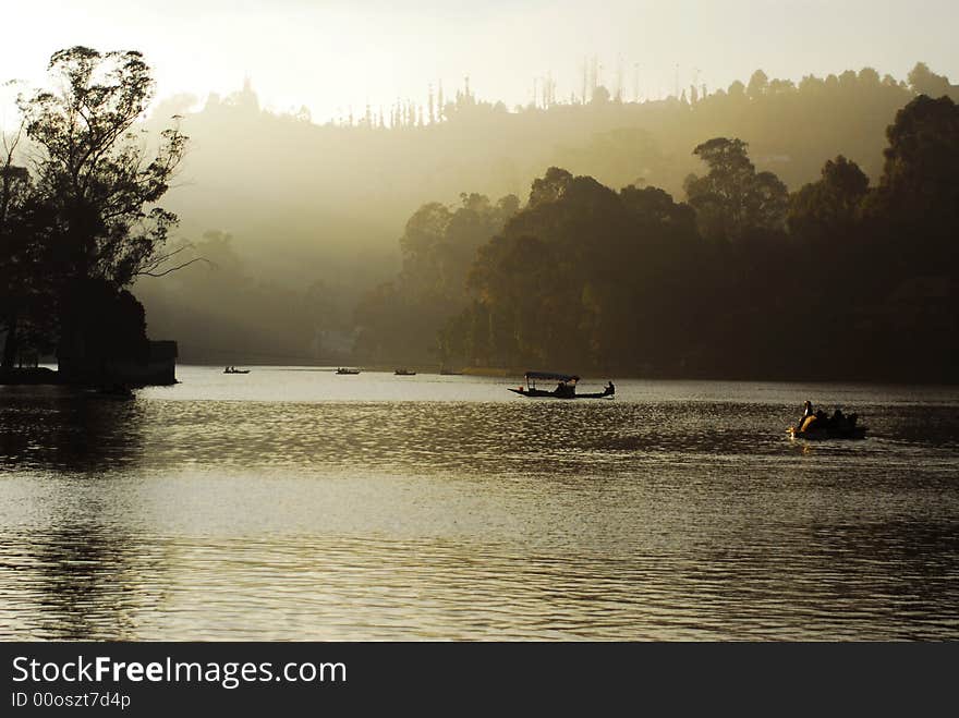 A boat in Kudai Kanal lake in India. A boat in Kudai Kanal lake in India.