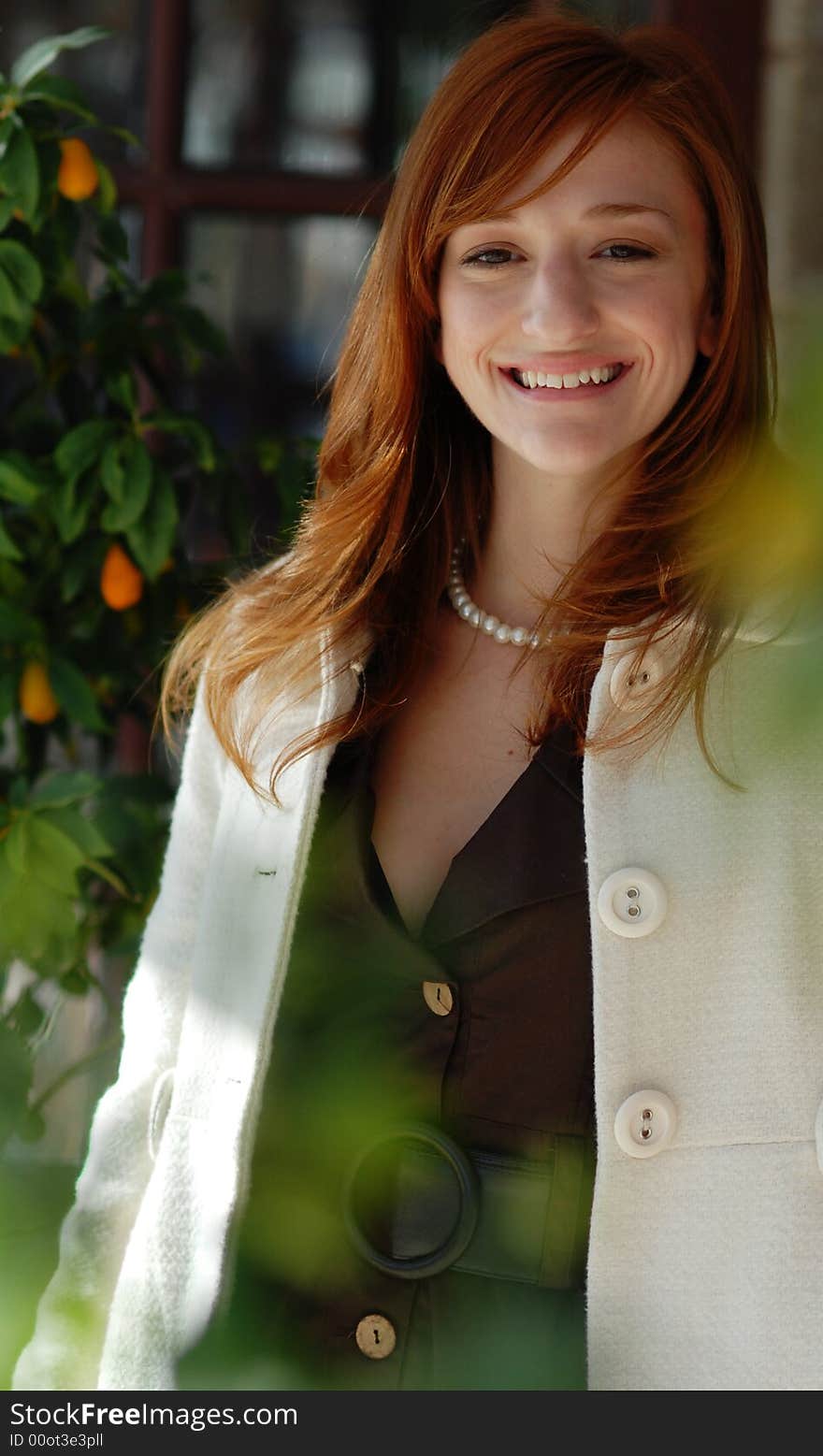 Attractive woman smiling with red hair