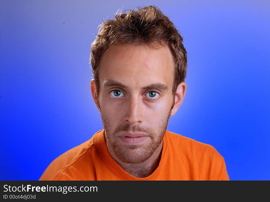 Portrait of casual young man on blue background. Portrait of casual young man on blue background