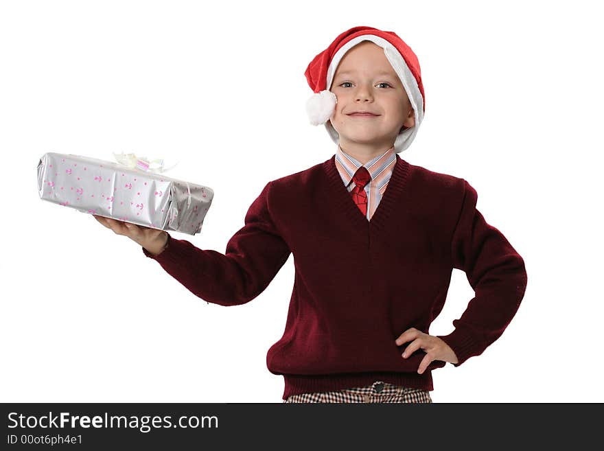 The boy in a cap Santa with a gift on a white background. The boy in a cap Santa with a gift on a white background