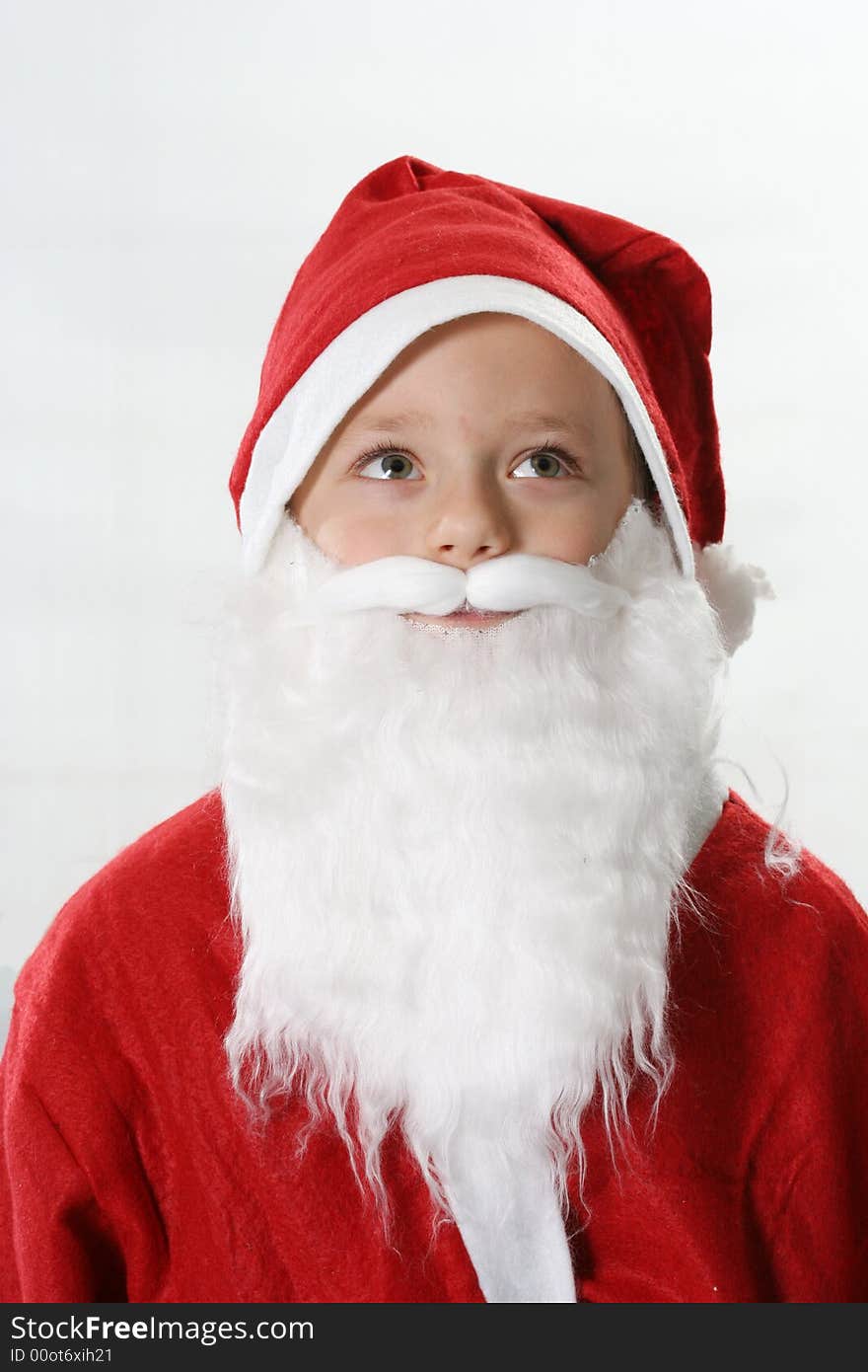 Portrait of the child in a red hat Santa-Claus