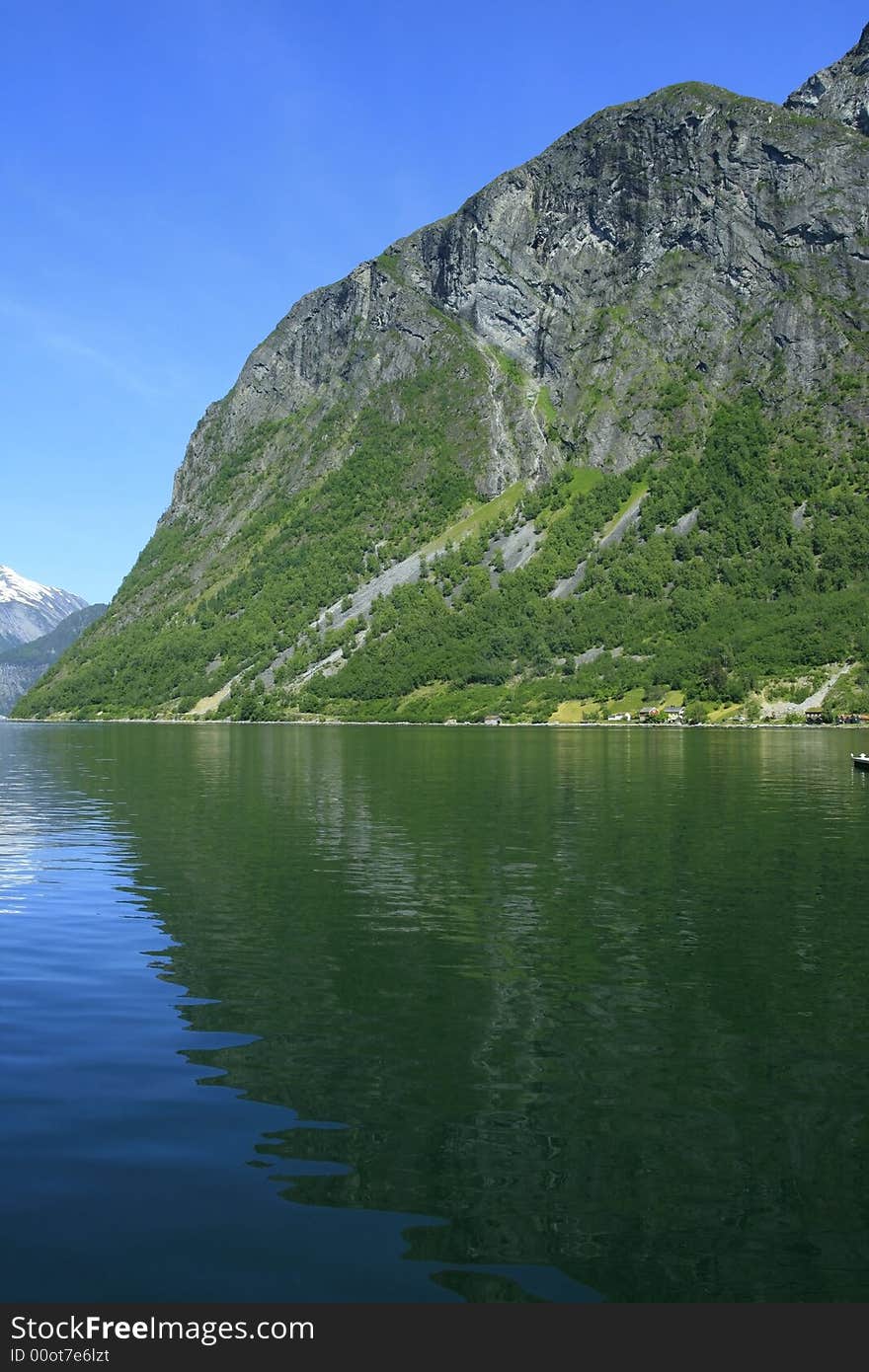 Green water of the Atlantic ocean and power of mountain