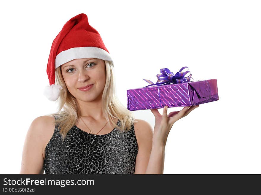 The young woman in red cap Santa with a gift in a hand