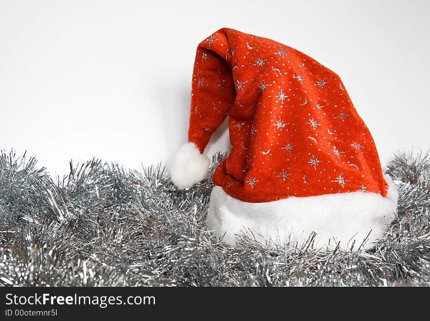 Santa Claus cap in the tinsel. New Year and Christmas decoration. canon 400d. Santa Claus cap in the tinsel. New Year and Christmas decoration. canon 400d