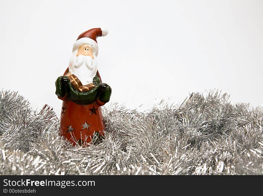 New Year and Christmas decoration with Santa Claus candleholder and tinsel. canon 400d