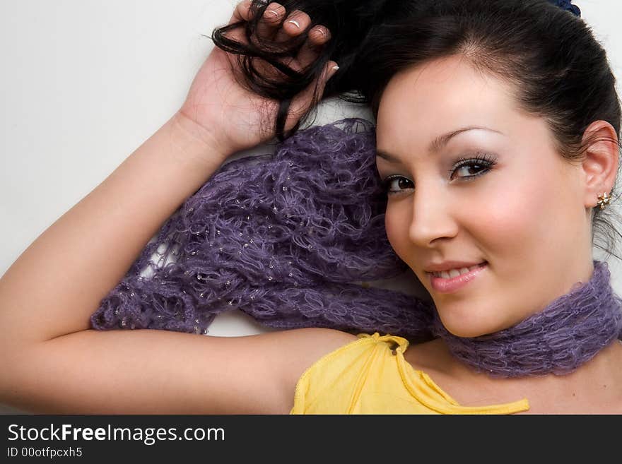 Stylish asian girl lying on white background. Stylish asian girl lying on white background