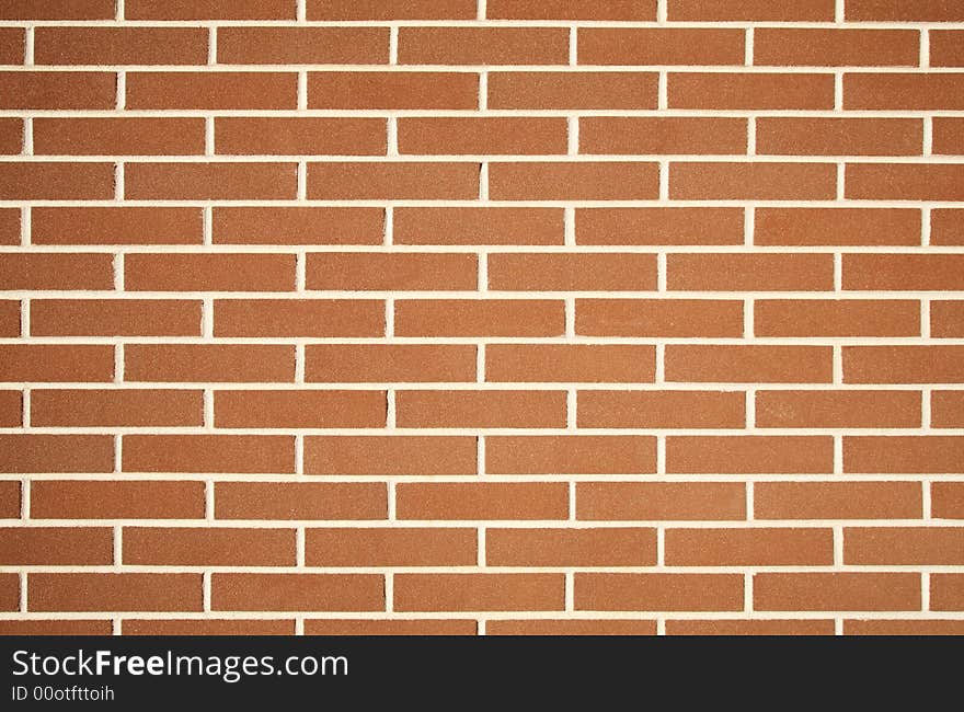 Photo of a plain red brick wall texture. Photo of a plain red brick wall texture