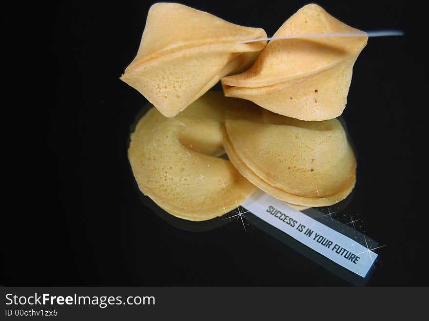 Fortune cookie reflected in a mirror. Fortune cookie reflected in a mirror.