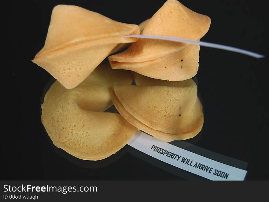 Pair of fortune cookies reflected on a mirror. Pair of fortune cookies reflected on a mirror.