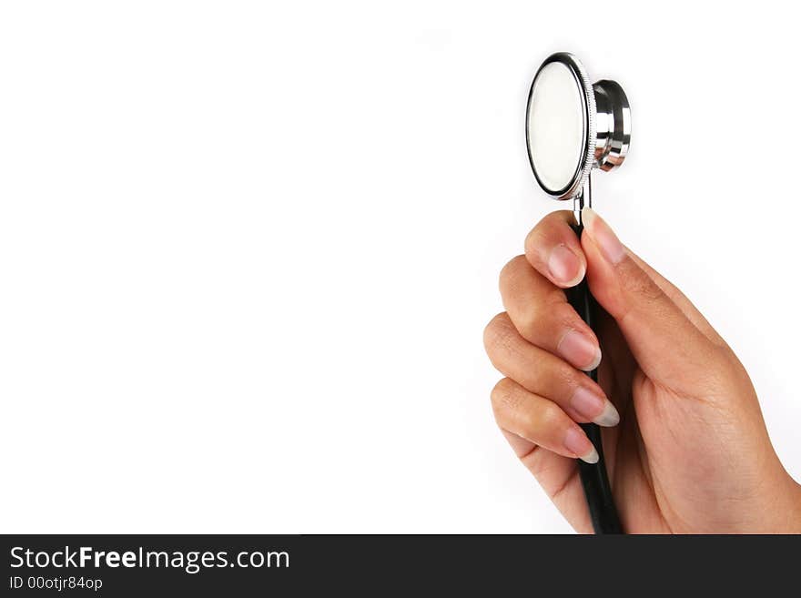 A hand holding a stethoscope in white background. A hand holding a stethoscope in white background.