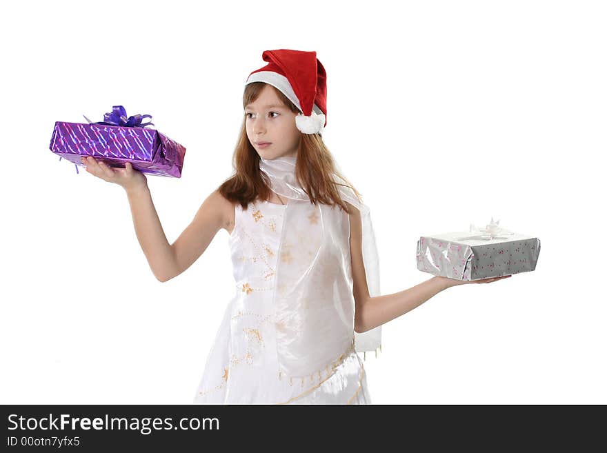 The girl in a white dress and cap Santa holds two gifts