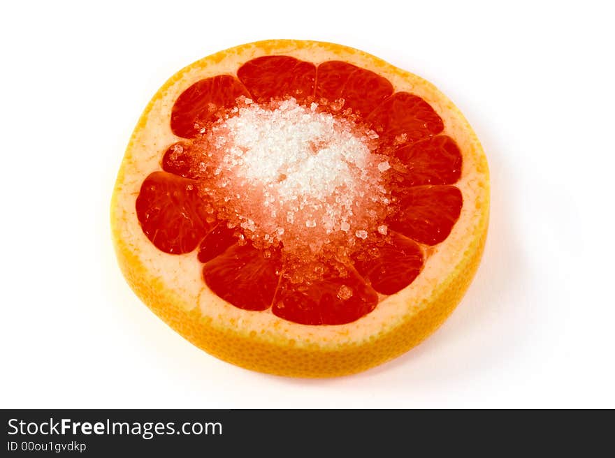 Orange slice with sugar on white background