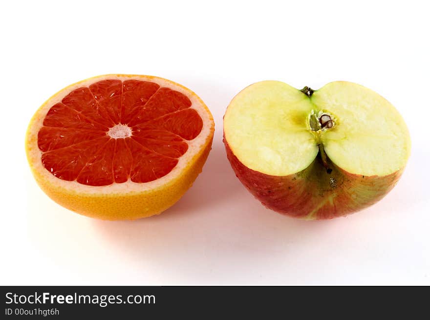 Fresh orange and apple on white background