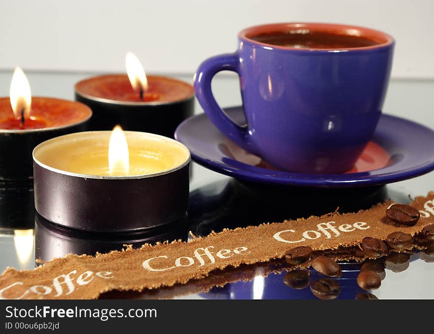 Cup of coffee and candles