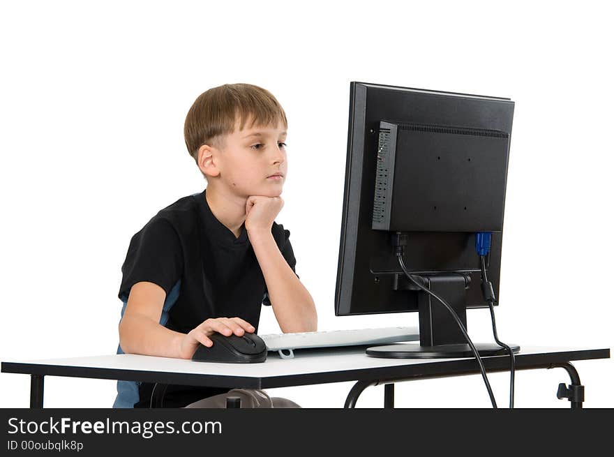 Boy on computer with cordless mouse and keyboard. Boy on computer with cordless mouse and keyboard.