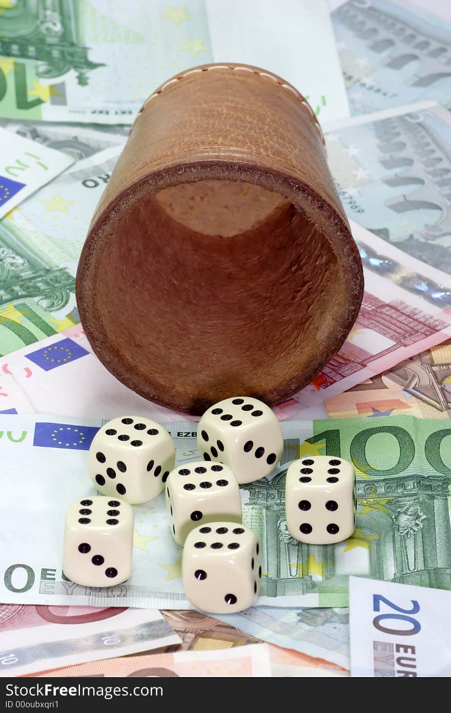 Dice shaker with dices on Euro notes. Dice shaker with dices on Euro notes