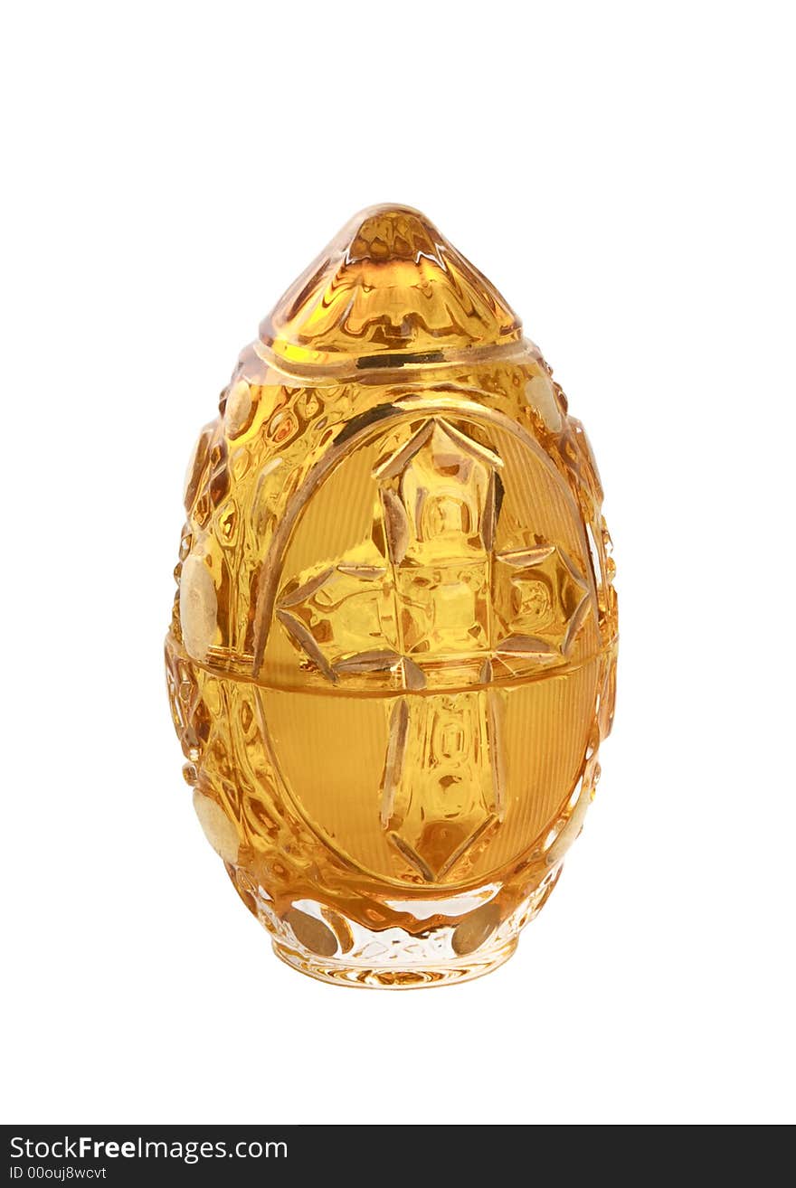 Glass yellow easter egg with a cross isolated on white. Glass yellow easter egg with a cross isolated on white