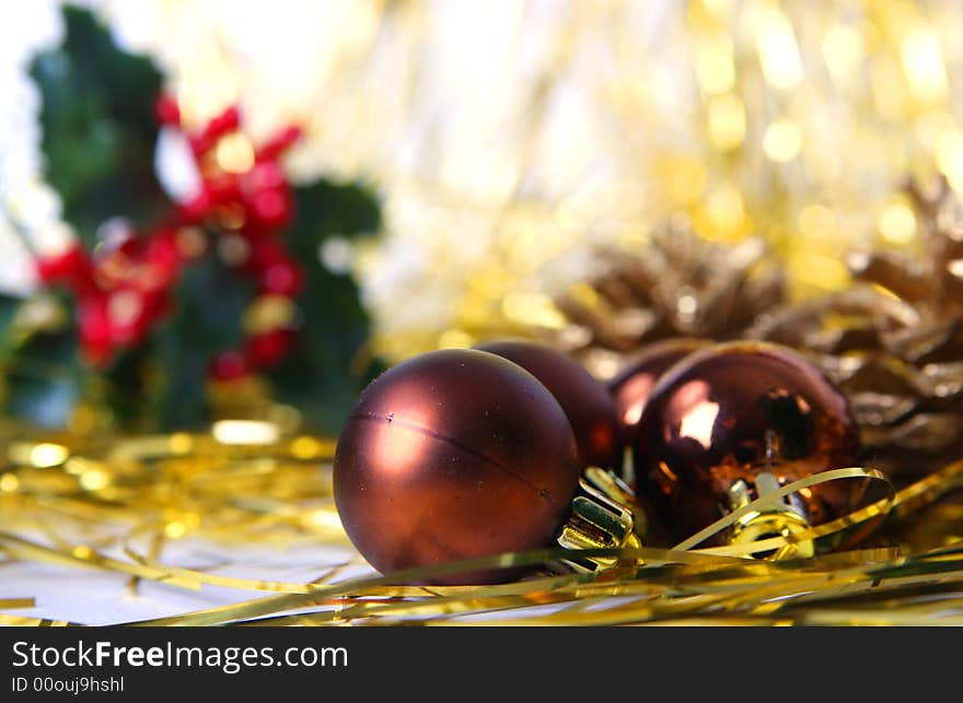 Christmas ornament, brown balls and gold background