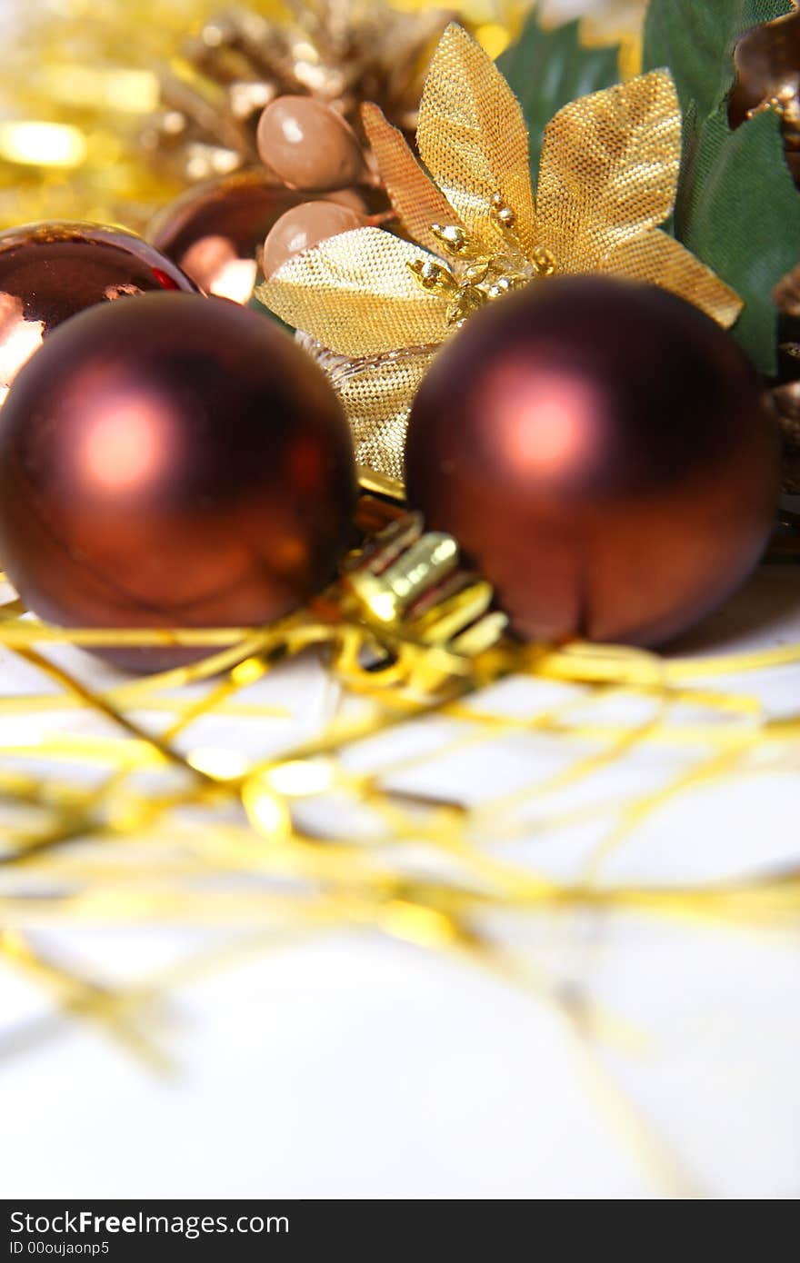 Christmas ornament, brown balls and gold background