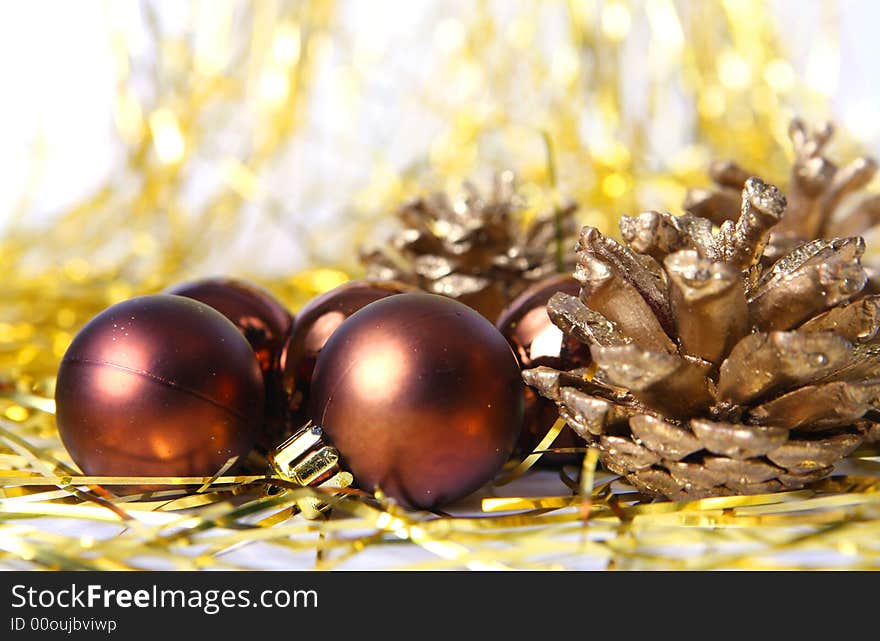 Christmas ornament, brown balls and gold background