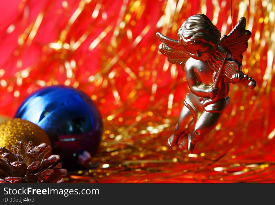 Christmas ornament, angel and red=gold background