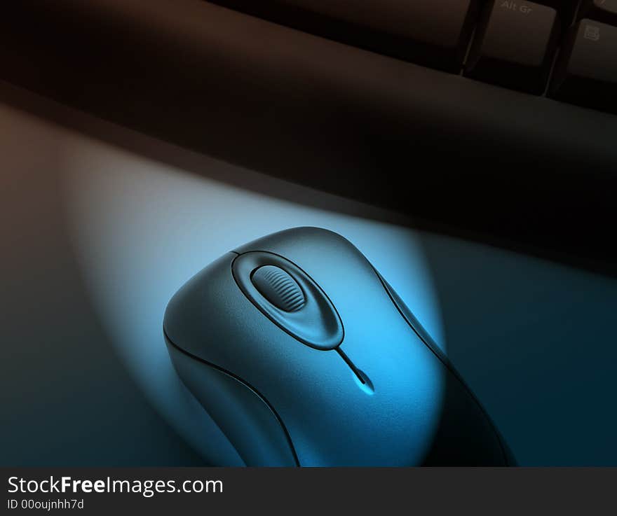 Spotlight effect illuminates wireless keyboard and mouse. Spotlight effect illuminates wireless keyboard and mouse